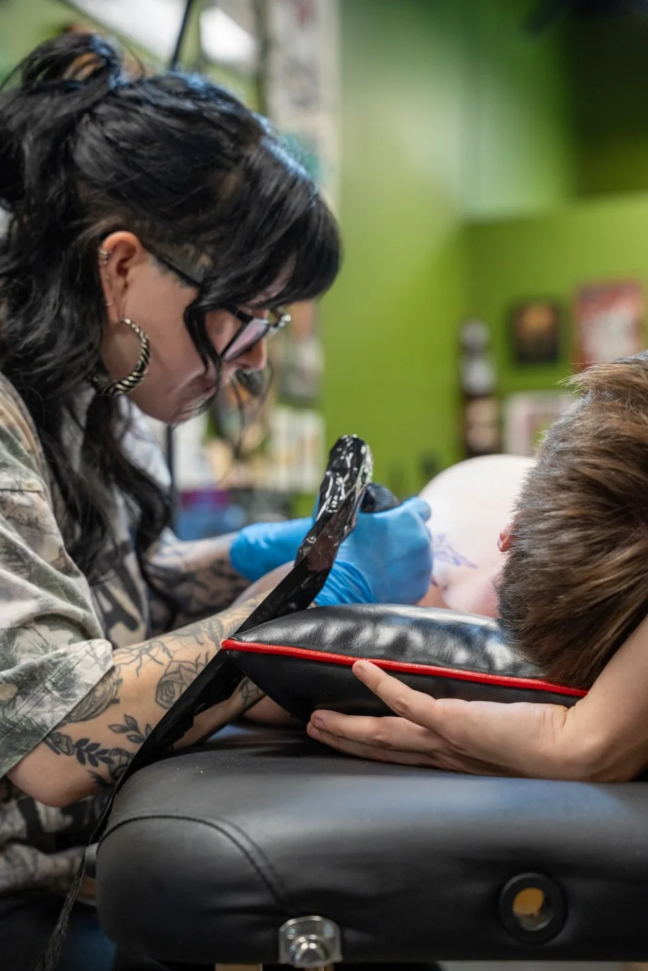Halle tattooing at Whole Heart Tattoo